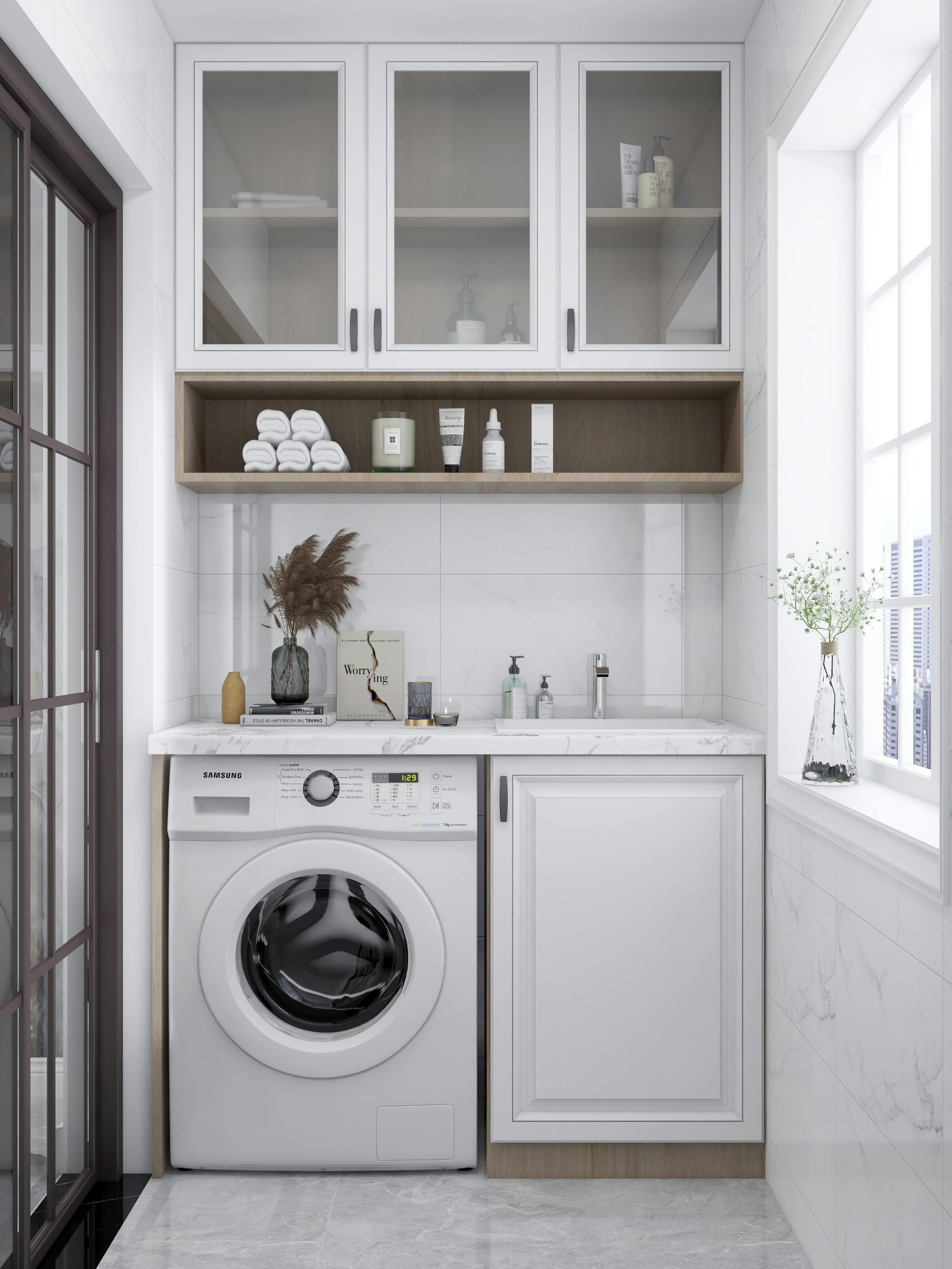 Une buanderie élégante et lumineuse avec une machine à laver, des placards et une décoration naturelle.